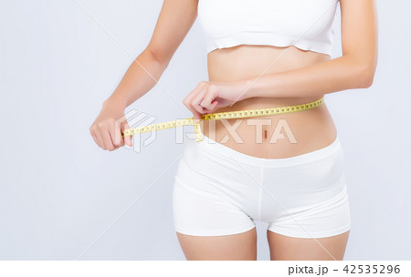 Asian woman diet and slim with measuring waist Asian woman diet and slim with measuring waist 42535296
