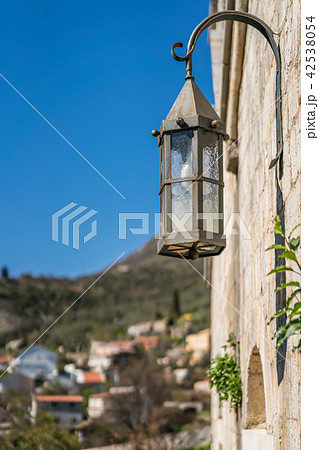 Old metal lamp on the fortress wall 42538054