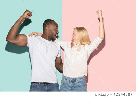 We won. Winning success happy afro man and woman celebrating being a winner. Dynamic image of 42544387
