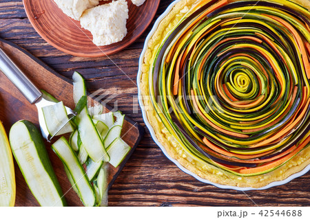 Spiral quiche with zucchini, eggplant, carrot Spiral quiche with zucchini, eggplant, carrot 42544688