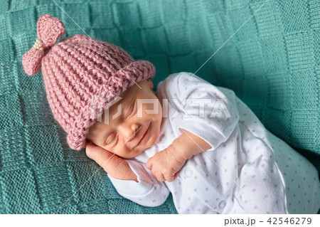 Smiling newborn baby sleeps deeply. Smiling newborn baby sleeps deeply. 42546279