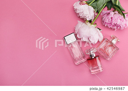 bottle of perfume and peony flowers bottle of perfume and peony flowers 42546987
