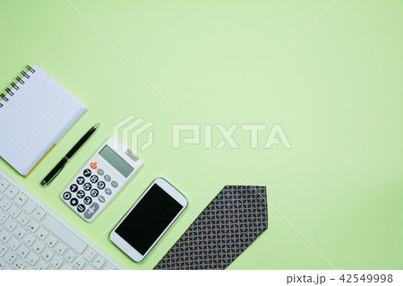 The office supplies on green background The office supplies on green background 42549998