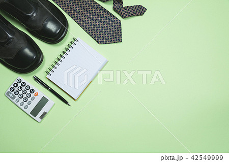 The office supplies on green background 42549999