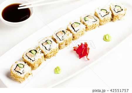 sushi rolls with salmon and cucumber avocado 42551757