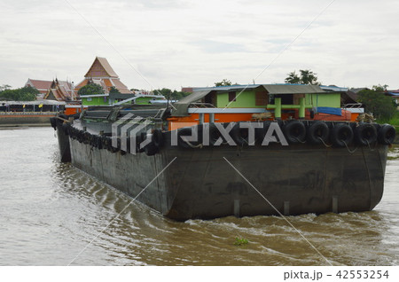 big container sand boat sailing on canal in Thaila big container sand boat sailing on canal in Thaila 42553254