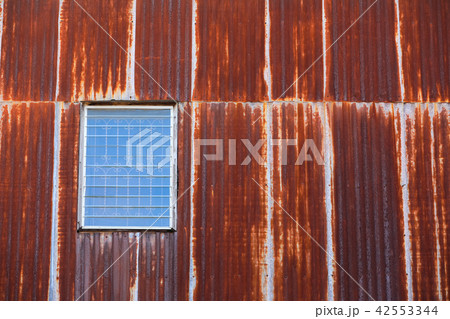 Old style window with Rusty corrugated iron metal Old style window with Rusty corrugated iron metal 42553344