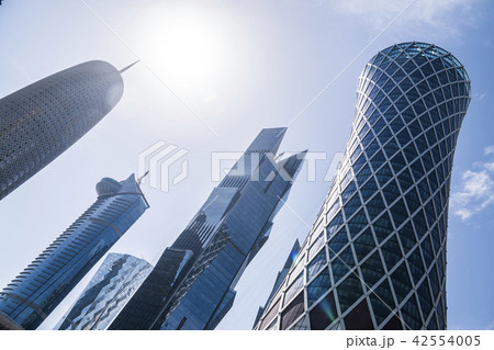 DOHA, QATAR - FEB 2018: Wide Angle Shot of Modern Blue High Skyscrapers in Doha city, Qatar. DOHA, QATAR - FEB 2018: Wide Angle Shot of Modern Blue High Skyscrapers in Doha city, Qatar. 42554005