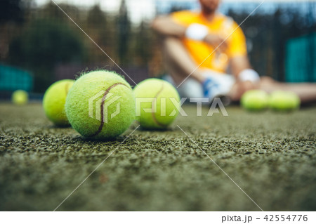 Tennis balls on modern field 42554776
