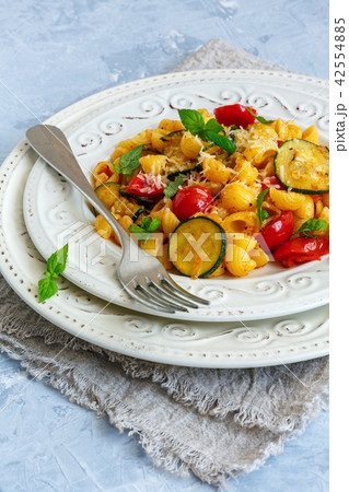 Pasta with cherry tomatoes,zucchini and fresh mint Pasta with cherry tomatoes,zucchini and fresh mint 42554885
