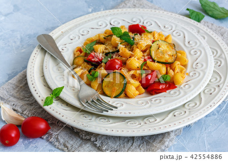 Pasta with zucchini and cherry tomatoes. Pasta with zucchini and cherry tomatoes. 42554886