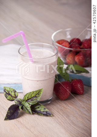 Smoothies with strawberries and basil in a glass 42570607