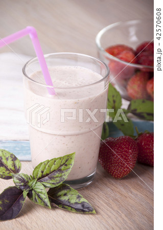 Smoothies with strawberries and basil in a glass 42570608