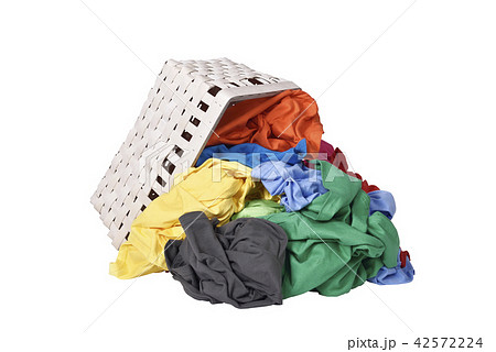 Colorful clothes spilled from wooden basket Colorful clothes spilled from wooden basket 42572224