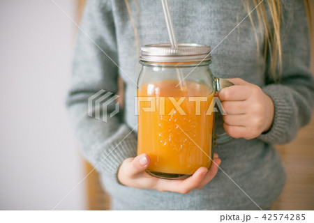Cute little girl with glass of orange juice  42574285