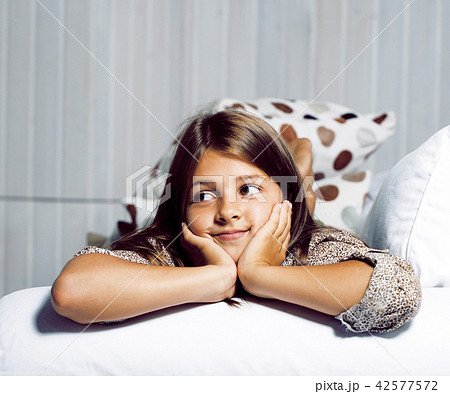 little cute brunette girl at home interior happy smiling close u 42577572
