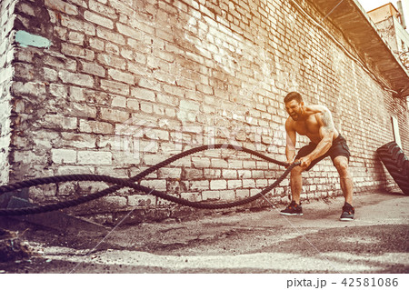 Men with rope, functional training 42581086