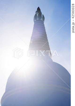 Buddhist stupa against the sun.. 42583028