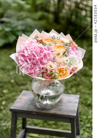 Beautiful pink summer bouquet on wooden table. Arrangement with mix flowers. The concept of a flower 42583034