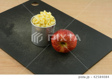 Red Delicious apple and chopped apple Red Delicious apple and chopped apple 42584084