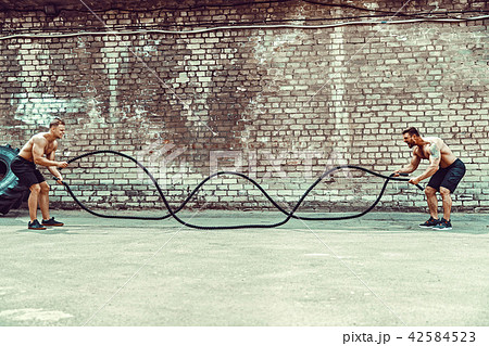 Men with rope, functional training Men with rope, functional training 42584523