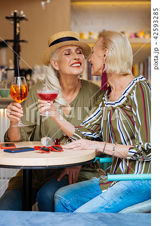Nice lesbian couple sitting in the restaurant 42593285