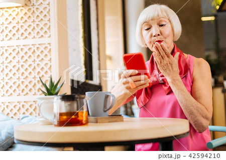 Joyful happy woman sending a kiss Joyful happy woman sending a kiss 42594210