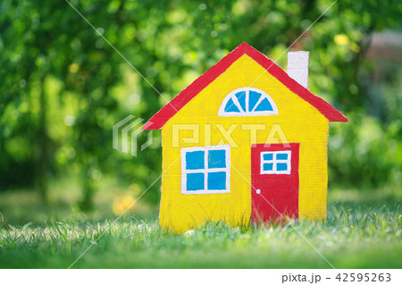 red wooden house on the grass red wooden house on the grass 42595263