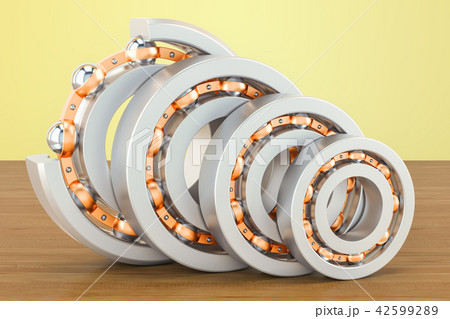 Ball bearings, cutaway on the wooden table 42599289