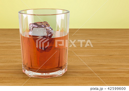 Glass with alcohol drink and ice on the table Glass with alcohol drink and ice on the table 42599600