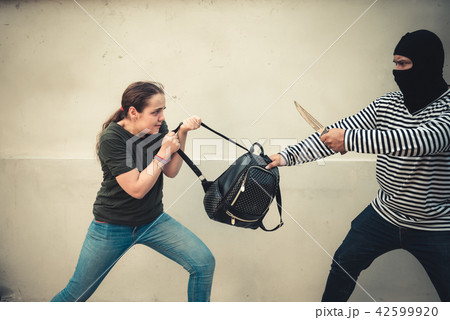 Robber man snatching bag from tourist women Robber man snatching bag from tourist women 42599920