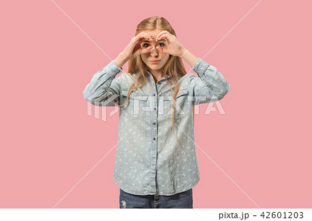 The young beautiful woman looking into the distance The young beautiful woman looking into the distance 42601203