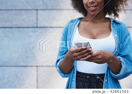 Young woman in jeans jacket free style on the street isolated on Young woman in jeans jacket free style on the street isolated on 42601503