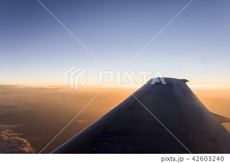 Nice sunset view on the wing of plane 42603240