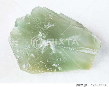 rough Prase (green quartz) stone on white rough Prase (green quartz) stone on white 42604324
