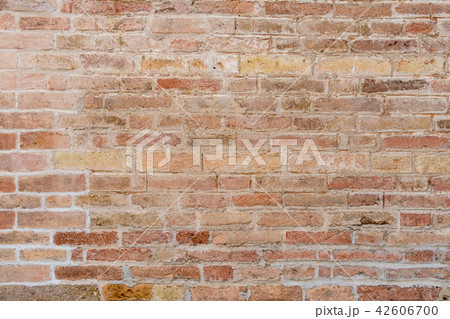 Old and damaged brown brick wall Old and damaged brown brick wall 42606700