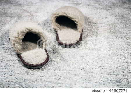 furry home Slippers brown on the carpet furry home Slippers brown on the carpet 42607271