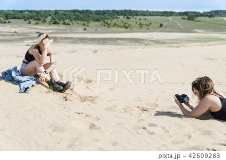 Photographing the model in the sands 42609283