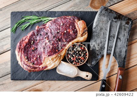 Marbling ribeye steak on wooden board 42609422