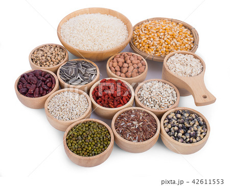 Cereal grains , seeds, beans on wooden background Cereal grains , seeds, beans on wooden background 42611553