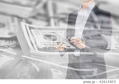 Businessman on background banknotes 42615855