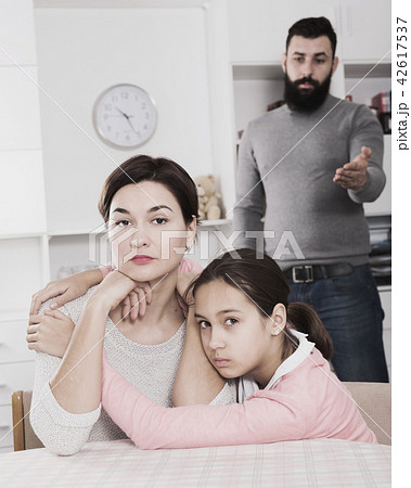 Father lecturing wife and daughter 42617537