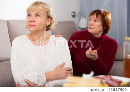 females quarreling in the room females quarreling in the room 42617900