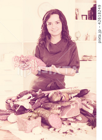 Girl with jamon and sausage Girl with jamon and sausage 42618249