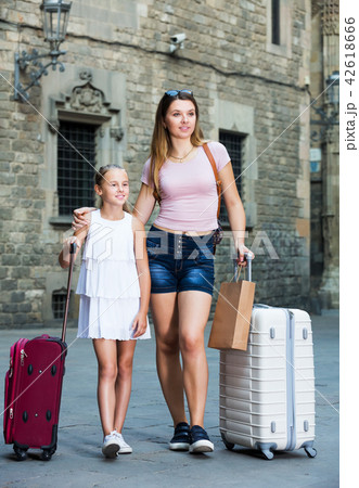 Mother with daughter travelers strolling Mother with daughter travelers strolling 42618666