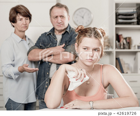 Adult woman is upseting and her parents are sympathying with her Adult woman is upseting and her parents are sympathying with her 42619726
