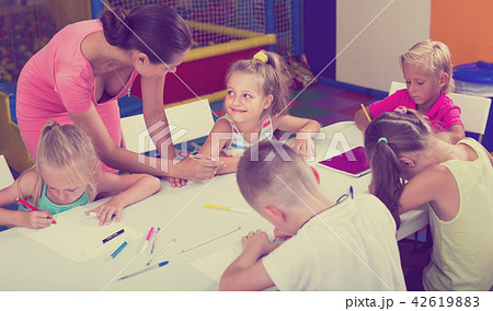 Children drawing pencils on lesson in school class 42619883