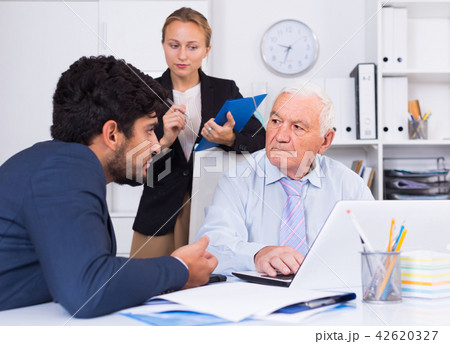 Mature man is talking to colleague 42620327