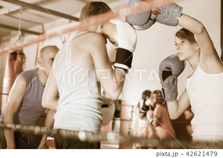 Children training on boxing ring 42621479