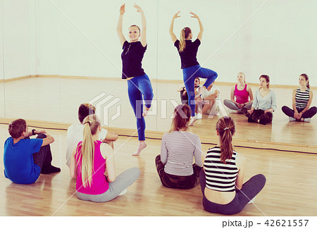Dance teacher demonstrates new position Dance teacher demonstrates new position 42621557